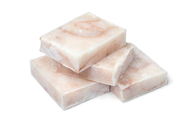 istock Pieces of frozen cod fish fillets close up 1254974122
