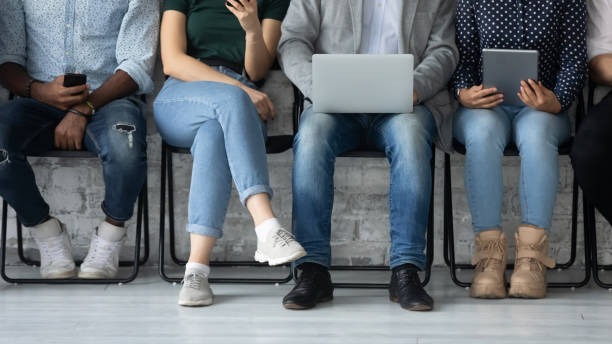 istock Diverse people with devices waiting for job interview turn 1254975579