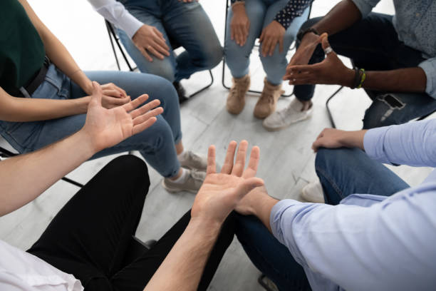 istock Participants communicating during corporate teambuilding or rehab group session 1254975608