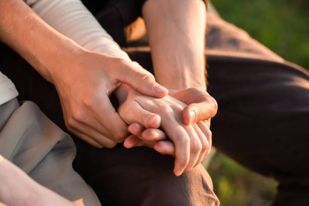istock A young woman and a man holding hands 1254978189