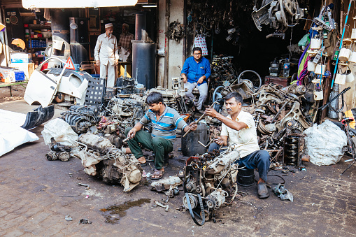 Mumbai, India - November 5 2016: Car parts for sale along the crowded streets within Chor Bazaar in Mumbai, India