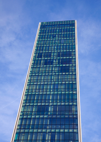 BILBAO, BASQUE COUNTRY / SPAIN - JANUARY 26, 2019: Modern building on blue sky background. Urban landscape in the city of Bilbao, Spain