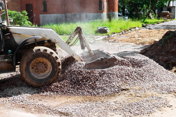 istock The tractor loads granite rubble into its bucket 1254982254