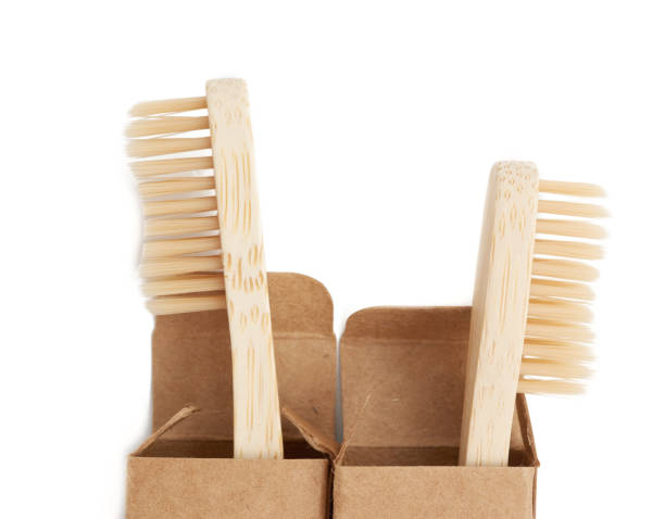 istock two wooden toothbrushes on a white background, plastic rejection concept 1254982444