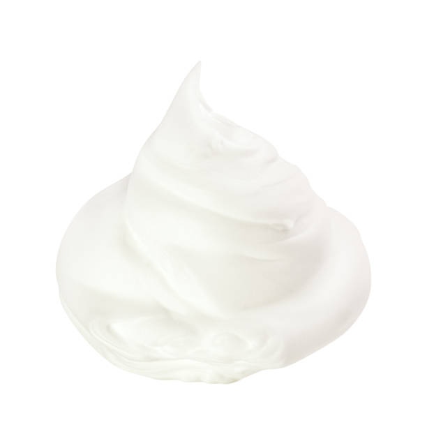 istock Whipped cream isolated on white background 1254982733