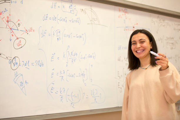 istock Students Studying mathematical formula in front of whiteboard 1254984755