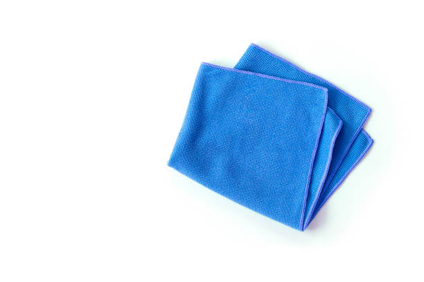 Microfiber cloth Closeup blue duster microfiber cloth for cleaning isolated on white background . Top view. Flat lay. microfiber stock pictures, royalty-free photos & images