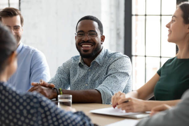 istock African team leader enjoy positive communication during briefing with workmates 1254989153