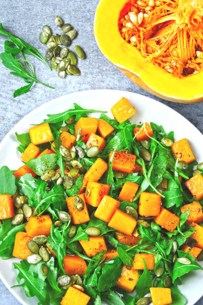 Pumpkin salad with arugula. stock photo