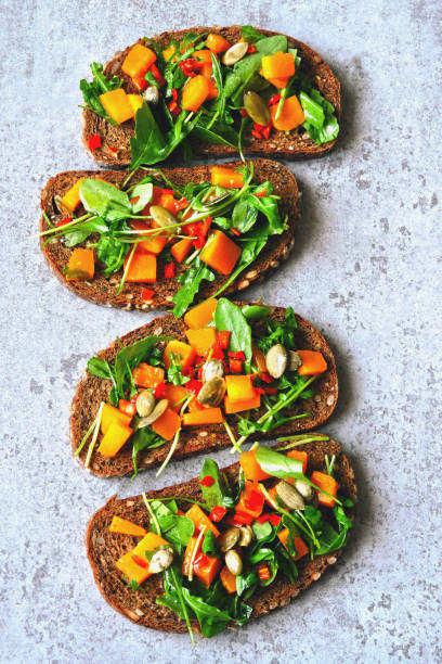 istock Toast with pumpkin and arugula. 1254990945