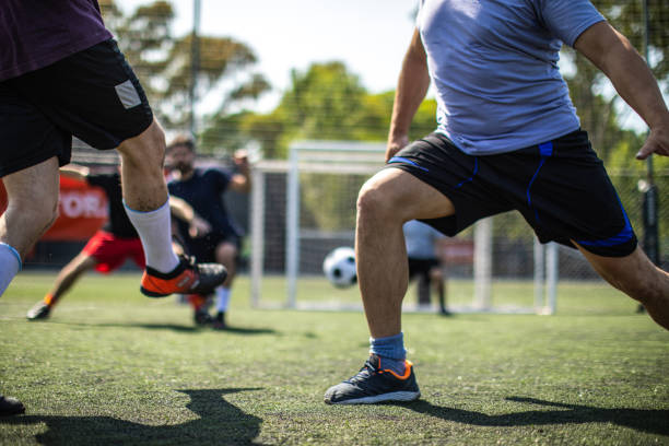 istock Soccer player trying to score a goal during friendly match 1254991971