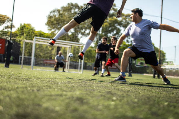 istock Soccer player trying to score a goal during friendly match 1254992614