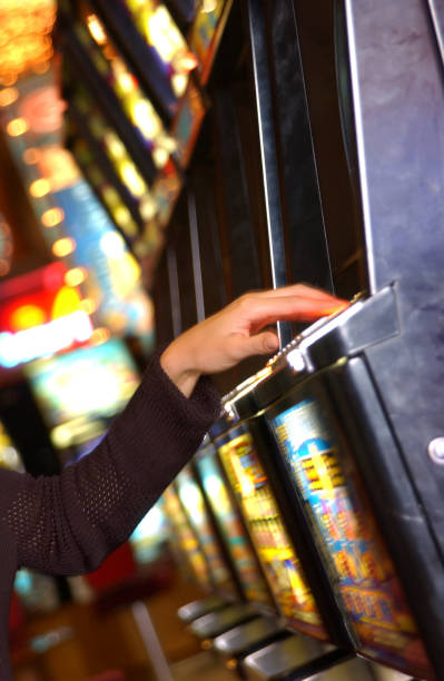 istock Woman playing slot machine 1254997815