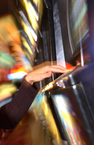 istock Woman playing slot machine 1254997827