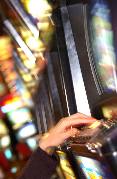 istock Woman playing slot machine 1254997856
