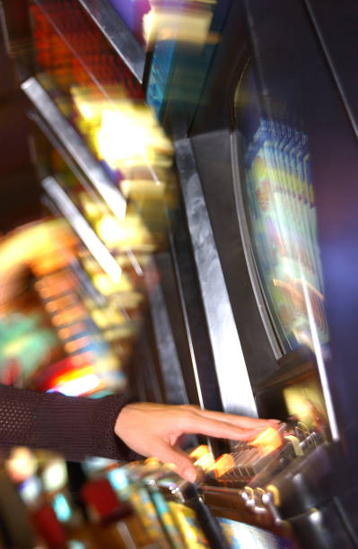 istock Woman playing slot machine 1254997966