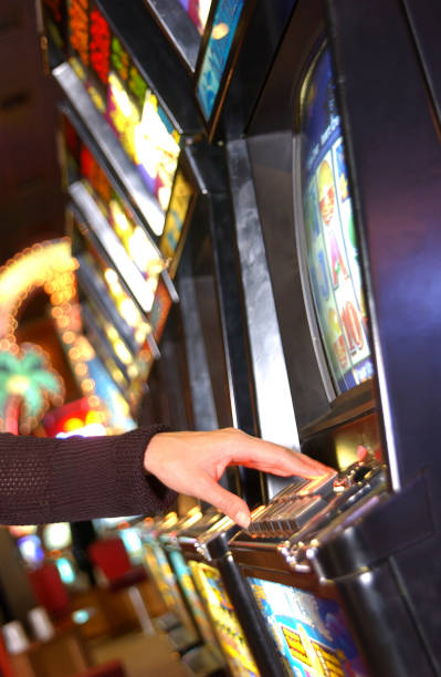 istock Woman playing slot machine 1254997984