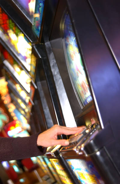 istock Woman playing slot machine 1254997995