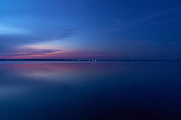 beautiful clouds during blue hour over the lake.