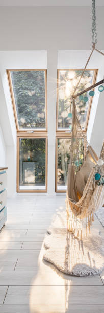 istock Attic room with stylish hammock, panorama 1255001758