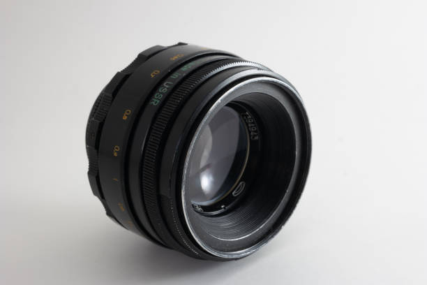 istock Vintage camera lens isolated on white. 1255001766