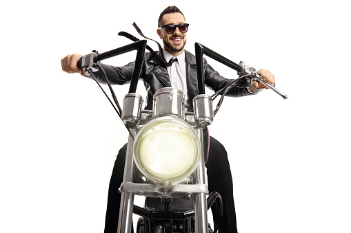 Biker with sunglasses riding a custom chopper isolated on white background