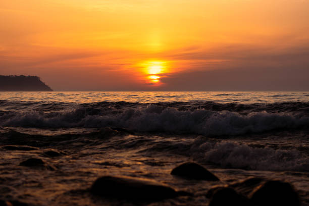 istock Dramatic golden sunset on a background of the Sea 1255004238