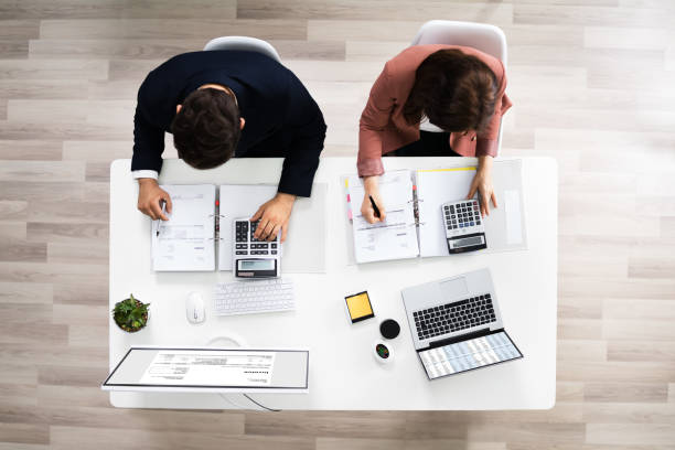 istock Auditors Calculating Corporate Invoicing 1255007136