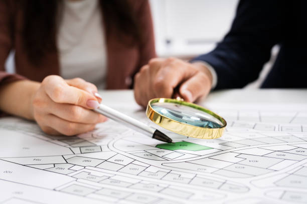 Close-up Of Human Hand Holding Magnifying Glass