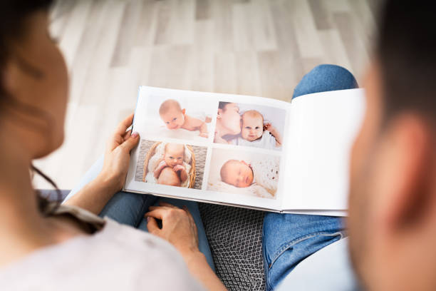 istock Couple Family Looking Photo Album 1255007708
