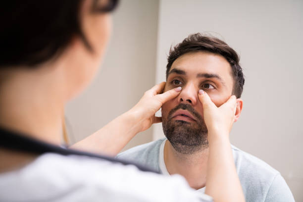istock Physician Doctor Doing Sinusitis Examination 1255007811