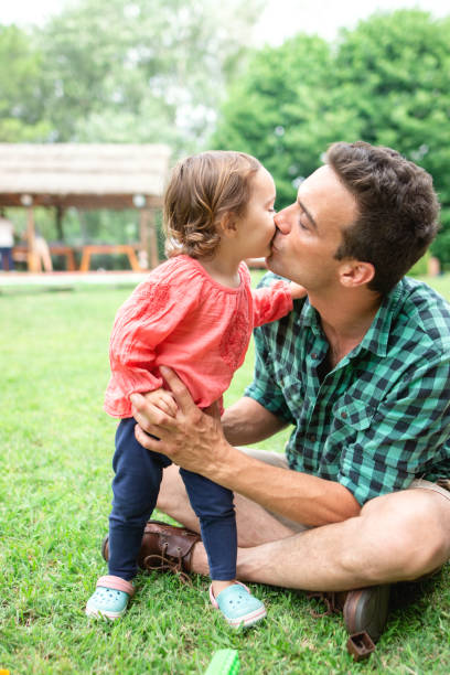 istock Dad playing with his daughter outdoors in the nature 1255008556