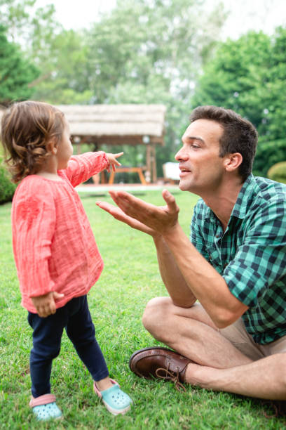 istock Dad playing with his daughter outdoors in the nature 1255008609