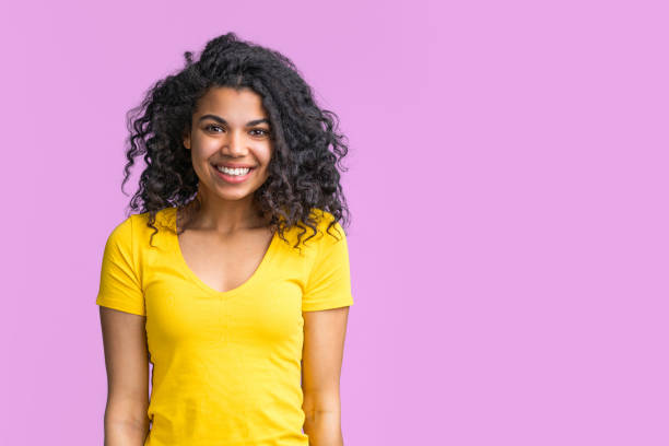 Charming young dark skinned lady with perfect smile