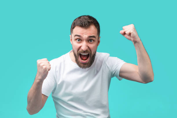 istock Young bearded man betting online at bookmaker's website 1255010822