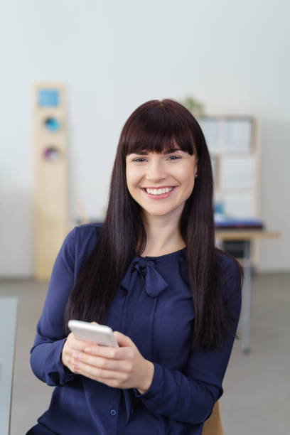 istock happy woman typing a message on her mobile phone 1255012774