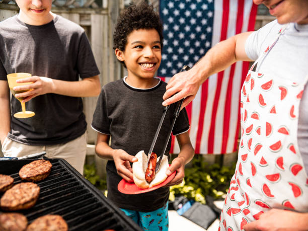 istock Burger line up at 4th July BBQ 1255013869