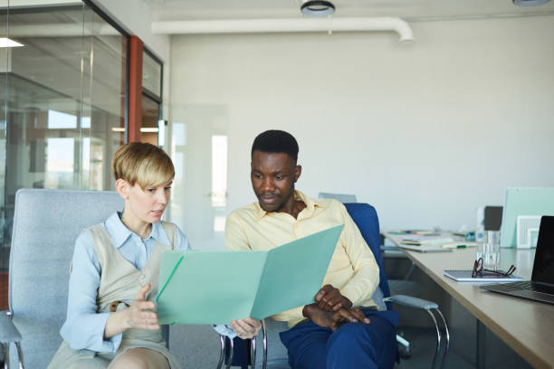istock African Businessman Discussing Project with Colleague 1255016573