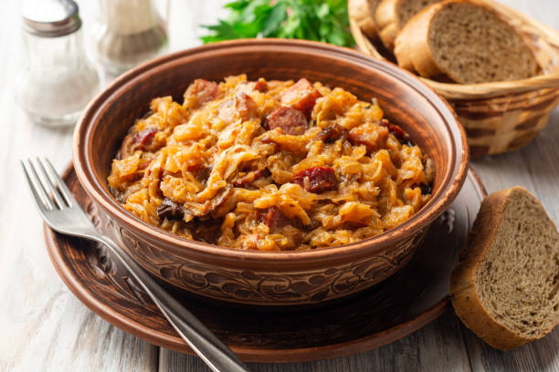 istock Traditional Polish dish Bigos in ceramic bowl on rustic wooden table 1255016840