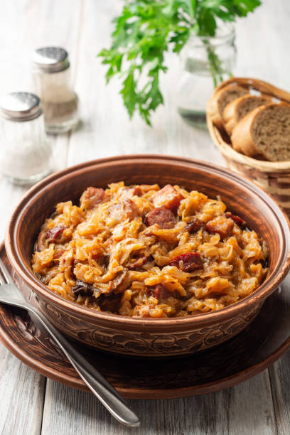 istock Traditional Polish dish Bigos in ceramic bowl on rustic wooden table 1255016844