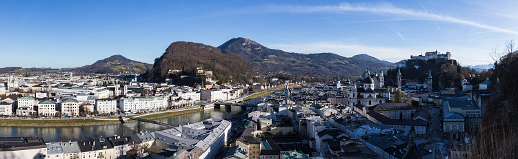Salzburg, Austria - December 18, 2019: Salzach River connects the new part of the city with the old town.  Salzburg, Austria is the birthplace of Wolfgang Amadeus Mozart.