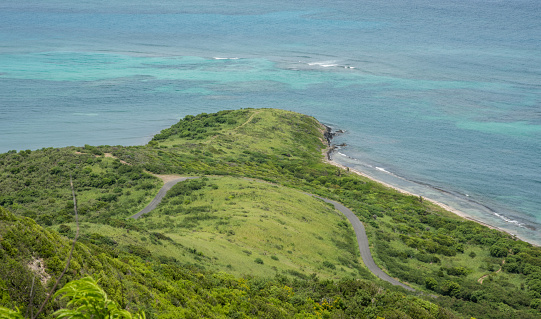 View from Goat Hill on St. Croix over the coastal road can Caribbean Sea shoreline on the east end of the US Virgin Islands