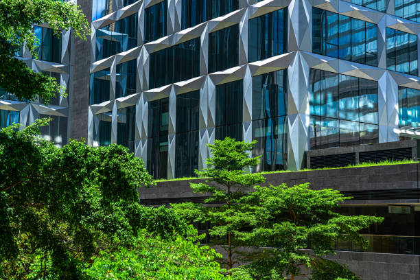 istock Business towers and Green leaves 1255018512