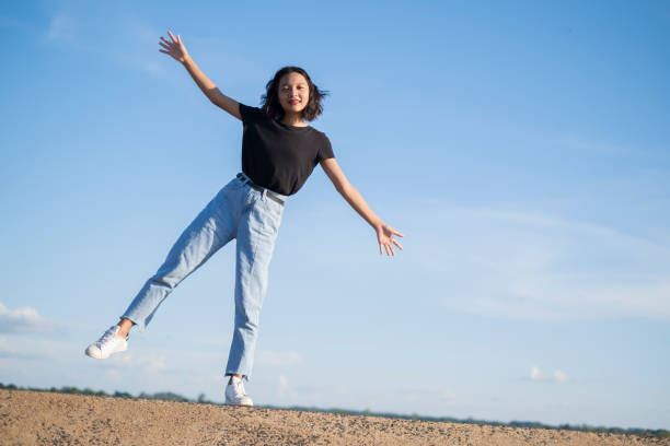 istock Happy young asian girl with blue sky. 1255020537