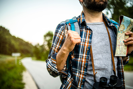 Hitchhiking with thumb up - Adventurer uses alternative transport - Sloboda - Hitchhiking and sightseeing