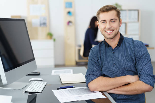 istock Smiling confident handsome businessman 1255020636