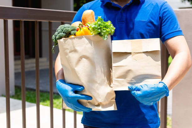 istock Postman giving.stay at home concept. 1255021559