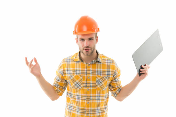 istock What is real cost. Renovation concept. Planning changes renovation. Foreman with documents. Supplies dealer. Project curator. Counting finances renovation. Man safety hard hat. Redevelopment of home 1255021655