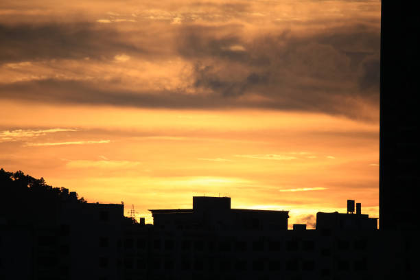 beautiful sunset with buildings in blackground