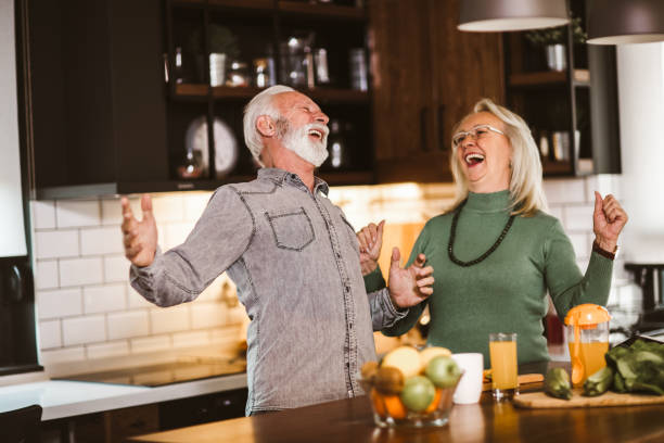 istock Senior couple preparing food in the kitchen. 1255021873